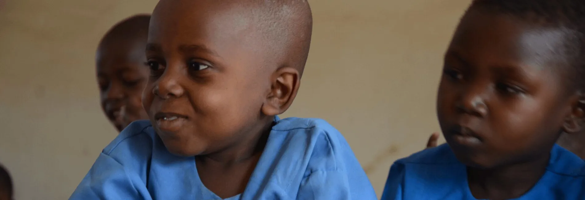 banner_nigeria_two-boys-in-blue-uniforms-sit-at-a-school-desk