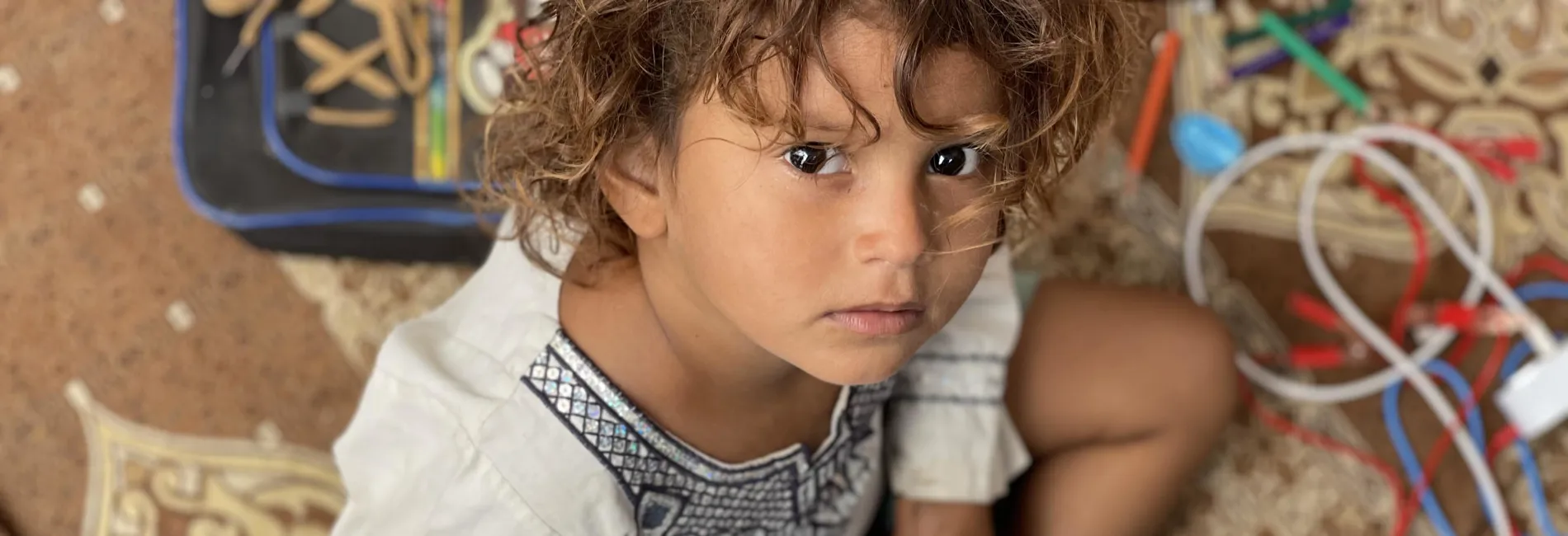 Tile Displaced Girl Practises Her Writing