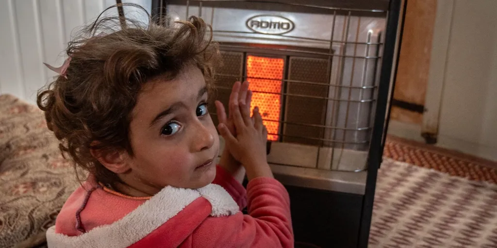 Jordan Syrian Refugee Girl Beside Gas Heater Zaatari