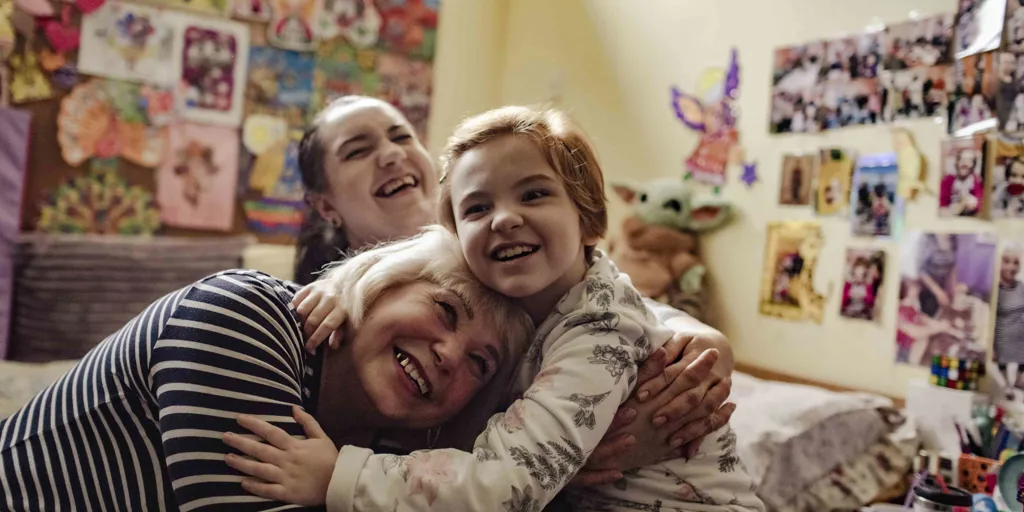 Nadia and her daughters Yuliia and Alisa in their room at the accommodation centre