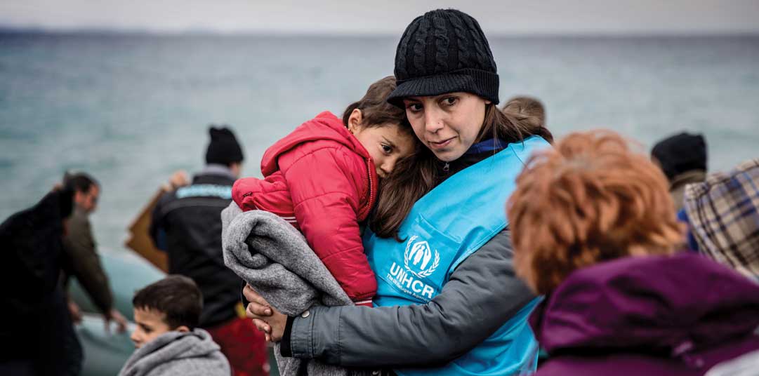 Greece_Comforting-newly-arrived-refugees