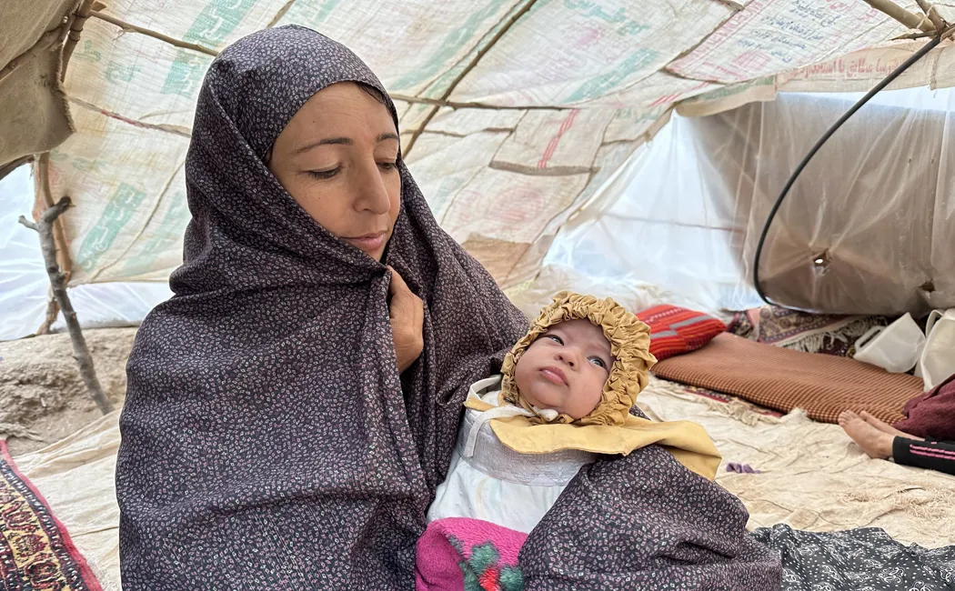 Afghanistan. Humaira, a mother of eight, received a tent and emergency items from UNHCR and partners
